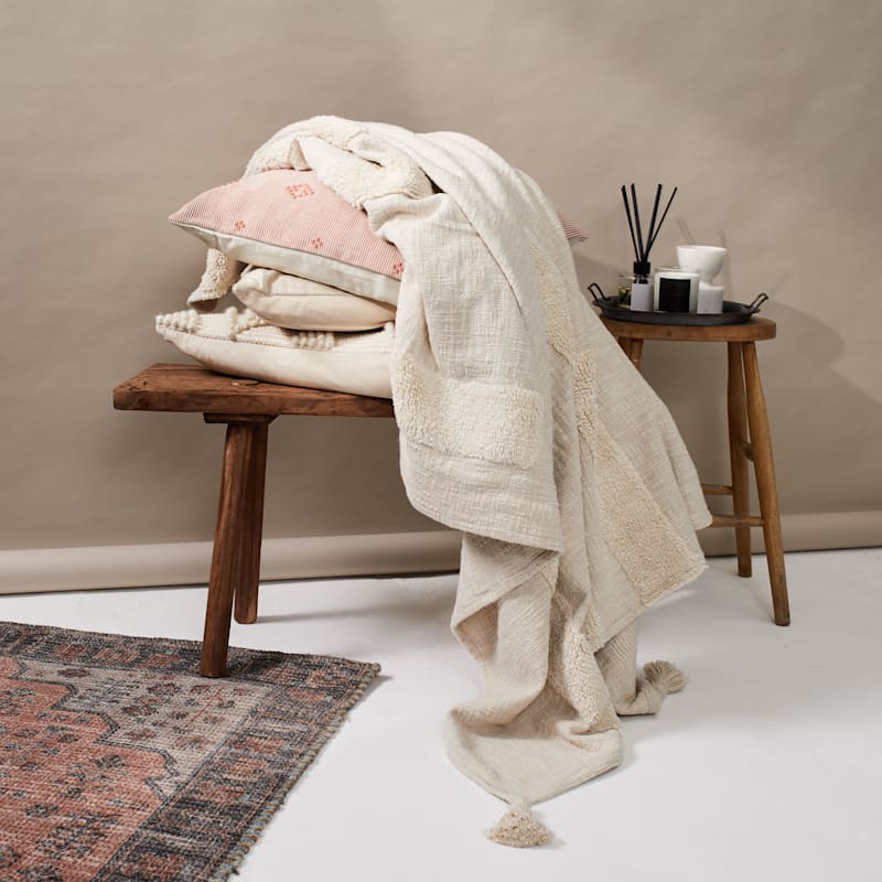 Cream Tufted Throw with Textured Detail Tassels Inside Story